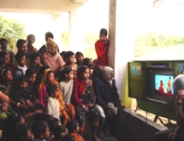 Photo of Bangladesh children watching Sesame Street.