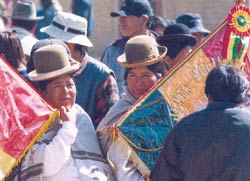 Photo of Bolivian indigenous women holding flags