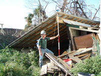 Tom Reiss collects global-positioning-system data from a roof corner near one of many homes destroyed by the 17th Street Canal levee breach.