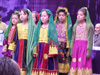 Photo: Afghan girls sing at a celebration of International Women's Day. Photo Credit: USAID/OTI.