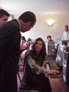 Photo: USAID Mission Director Craig Buck (left) talks with Narges (seated at the computer), one of 16 Afghan journalists trained under a program funded by USAID's Office of Transition Initiatives. Photo source: U.S. Department of State - Sally Hodgson.