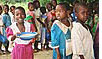 Photo of a school feeding program in Malawi, children receive porridge fortified with iron and other micronutrients.
