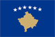 Flag of Kosovo: centered on a dark blue field is the geographical shape of Kosovo in a gold color surmounted by six white, five-pointed stars arrayed in a slight arc.