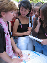 Tamara Mosheshvili, a health advocate, educates young women on breast self-exams during the Walk to Save Lives in Kutaisi, Geogia.