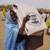 Displaced woman receiving USAID plastic sheeting in Mornei