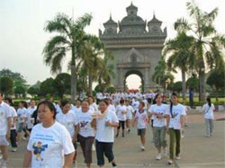 Participants march in an event organized by the Laos Women’s Union (LWU) in Vientiane, Laos, to show their support in the fight against avian influenza.