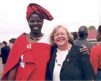 USAID Health Officer, Melinda Wilson stands next to a Hope Worldwide Counselor.