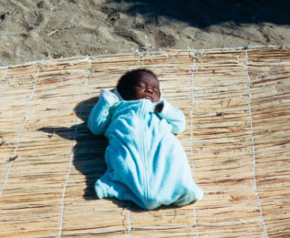 Photo of an infant found unvaccinated during a national immunization day house-to-house campaign in Lobito, Angola.