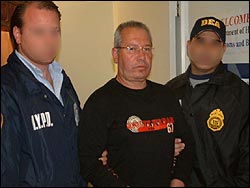 Manuel Felipe Salazar-Espinosa arrives at a New York area airport in 2006 after being extradited from Colombia.