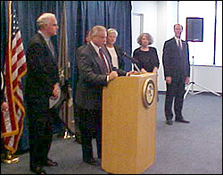 Assistant Special Agent in Charge Richard Ford speaking at the press conference to announce the arrest of Dr. Albert Kofosky for dispensing drugs over the internet as US Attorney Patrick Meehan (left of podium) looks on. 