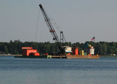 Dredging barge prepping for activities at the Occidental Clean-up site. In 2003, 10,500 cubic yards of contaminated sediment were removed from White Lake at the outfall eliminating the last known "hot spot" in the system