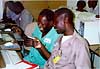 Manlafi and Kebe find great information on the Web at the Leland training in Bamako, December 1997.