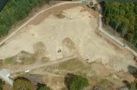 image - tree lined, road rimmed work area from air