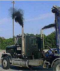 Truck with thick black smoke coming from exhaust