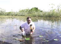 photo of scientist holding samples