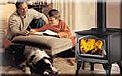 Image of people next to a wood stove