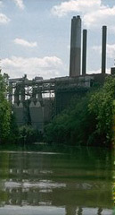 Photo of a factory next to a waterbody