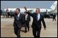 President George W. Bush arrives in Raleigh, North Carolina with Congressman Richard Burr on Wednesday July 7, 2004. The President was in North Carolina to meet with pending North Carolina judicial nominees.   White House photo by Paul Morse