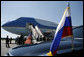 President George W. Bush and Mrs. Laura Bush wave from Air Force One upon arriving at Pulkovo International Airport for the upcoming G8 Summit in St. Petersburg, Russia, Friday, July 14, 2006.  White House photo by Paul Morse