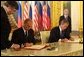 President George W. Bush and Russian President Vladimir Putin sign an arms reduction treaty at the Kremlin in Moscow, Russia on May 24, 2002.  