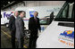 President George W. Bush and Secretary of Energy Sam Bodman listen to Mark Chernoby as the Vice President of Advance Vehicle Engineering at DaimlerChrysler describes the FedEx Pilot Program Plug-in Hybrid Sprinter during the President's visit Tuesday, March 27, 2007, to the U.S. Postal Service Vehicle Maintenance Facility in Washington, D.C. White House photo by Joyce N. Boghosian