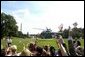 A sea of waving hands and flags bid farewell to President George W. Bush as he departs the South Lawn aboard Marine One Wednesday, Sept. 1, 2004.  White House photo by Lynden Steele