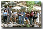 It may not be a show down at high noon, but a few good-natured shots are fired as President Bush gives the press pool a tour of his ranch at Crawford, Texas, Aug. 25. White House photo by Moreen Ishikawa.