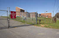 Picture of Plant with Camera and Fence with Sign