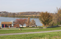 Recreational picture with people biking along lake/resevoir