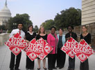 The Congresswoman with activists celebrating the passage of her legislation condemning gender-based violence.