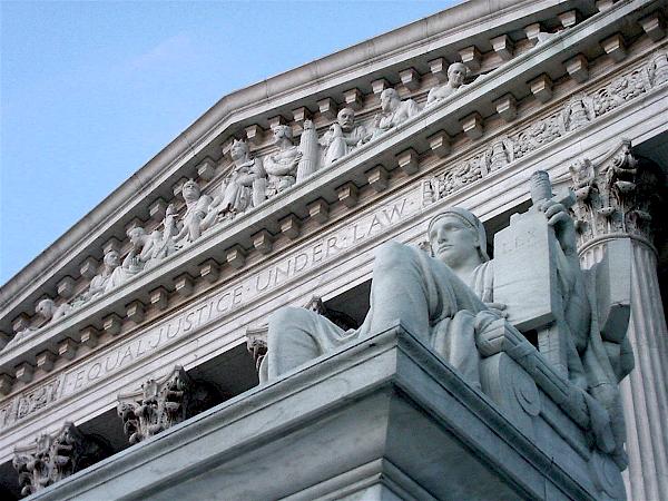The Supreme Court building with Authority of Law statue