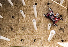 Photo of robots being trained to map spaces using their sensors. Click here for larger image.