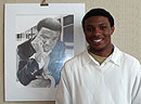 Tevin Drake, a sophomore at Opelika High School, won first place for his artwork titled “Self portrait” which was created with graphite.  Drake is pictured here with his artwork.