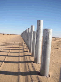 Images of the fence being built on the border between the U.S. and Mexico.