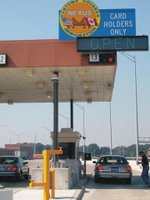 The picture shows a car entering the United States from Canada through a dedicated commuter lane.