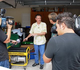 Davie, Fl, June 1, 2008- FEMA Administrator David Paulison demonstrates his family's personal hurricane preparedness items for the media at his home. Hurricane season began June 1. (FEMA Photo/Fernandez)