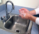 washing hands in sink