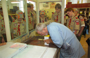 Master bookbinder Peter James gives a Boy Scout troop a marbling demonstration during a tour of the GPO in the summer of 2005.