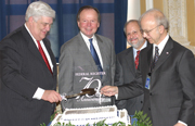 Public Printer Bruce James, former Federal Register Director Richard Claypoole, current Federal Register Director Raymond Mosley and Archivist Allen Weinstein get set to cut the cake commemorating the Federal Register's 70th Anniversary.