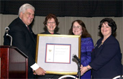 Bruce James & Judy Russell present Depository of Year Award to Linda Saferite & Suzanne Sears