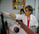 Pediatrician with mother and child