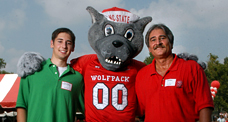 Parents and future NC State students take a campus tour, including a visit to The Brickyard.