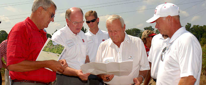 From left to right, Lonnie Poole, Chancellor James Oblinger, Board of Trustees Chair McQueen Campbell, golf legend Arnold Palmer and Erik Larsen, Palmer Designs and NC State alumnus ('77), look over plans for the new golf course on Centennial Campus at the groundbreaking ceremony on July 9, 2007. The Poole family donated $3 million for the course's construction, which is slated to be completed spring 2009.