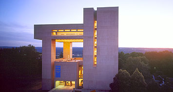 Johnson Museum glowing with golden light at sunset