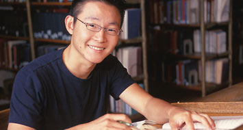 Smiling student studying