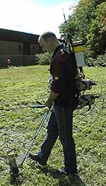 photo of a staff doing radiation measurements and sending data to a computer