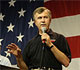 Secretary of Agriculture, Mike Johanns, speaking in front of American Flag