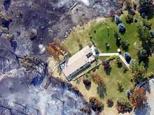 An aerial picture of a house saved on the Canyon Ferry Fire.