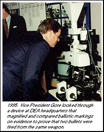 photo - 1995: Vice President Gore looked through a device at DEA headquarters that magnified and compared ballistic markings on evidence to prove that two bullets were fired from the same weapon.