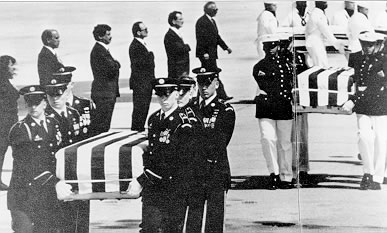 photo of caskets being carried